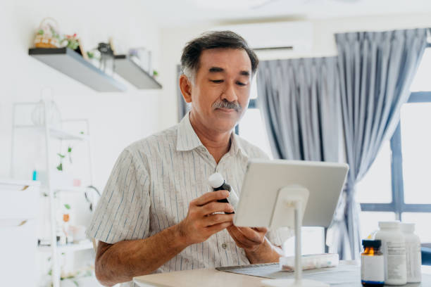 istock Telemedicine senior man video calling doctor using digital tablet 1321906111
