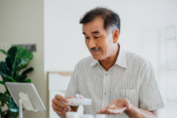 istock Telemedicine senior man video calling doctor using digital tablet 1321906141