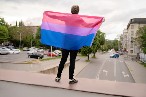 A man holding the lesbian flag to show his support