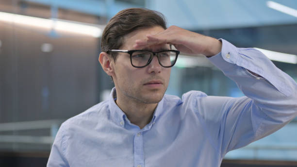 istock Portrait of Young Man Looking Around, Searching 1321909045