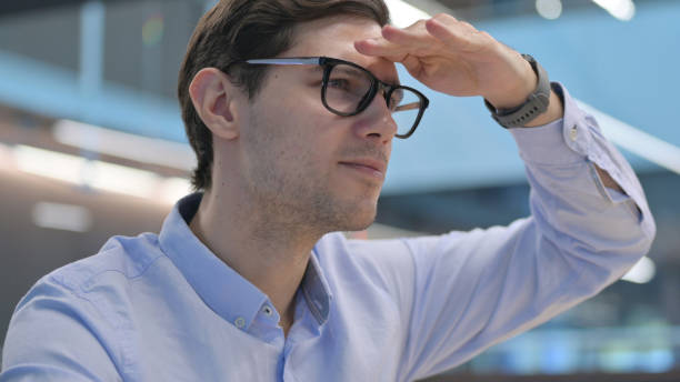 istock Close up of Young Man Looking Around, Searching 1321909384