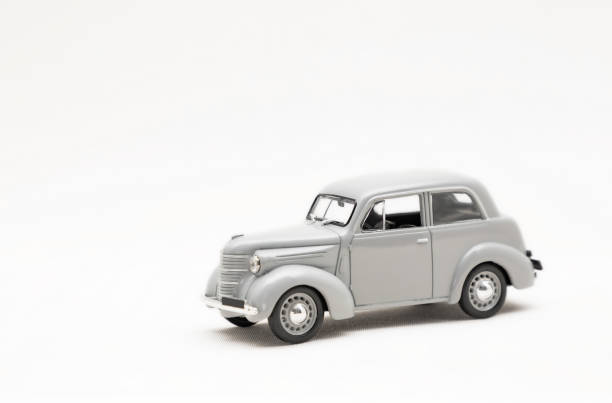 istock Toy small model of a retro car on a white background 1321911295