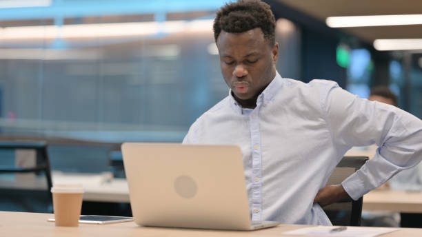 istock African Businessman with Laptop having Back Pain 1321917754