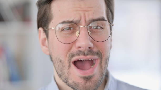 istock Face Close up of Shocked Young Man 1321918814