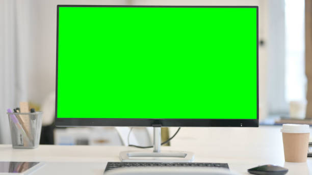 istock Close up of Desktop with Green Chroma Key Screen 1321919316