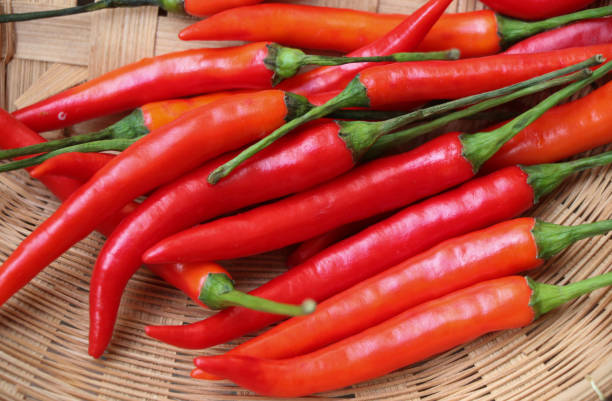 istock Close up the red hot peppers in the bamboo basket 1321929100