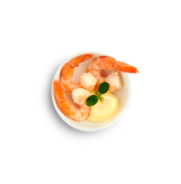 shrimp cocktail small bowl with prawns, mayonnaise and herbs. Top view isolated on white background asa animal stock pictures, royalty-free photos & images