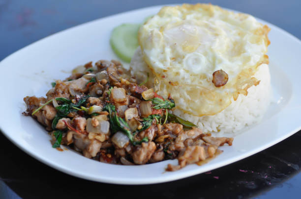 istock stir fried pork with holy basil , sunny side up egg and rice 1321931228