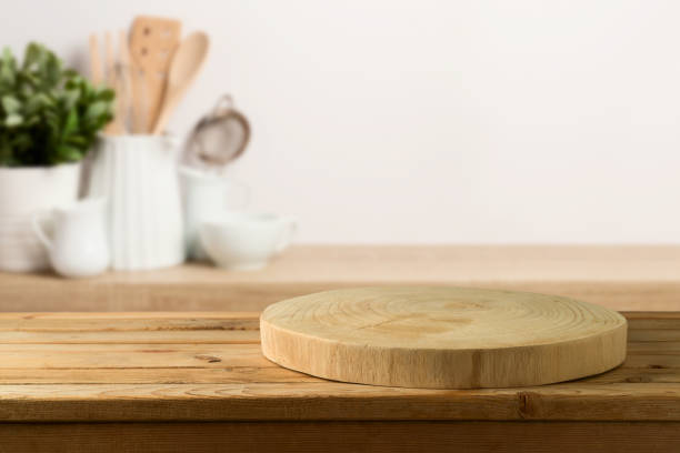 istock Empty wooden log on rustic table over kitchen shelf background.  Interior mock up for design and product display. 1321931236