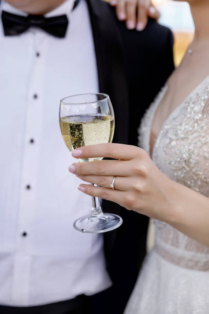 istock the bride and groom drink champagne 1321934233