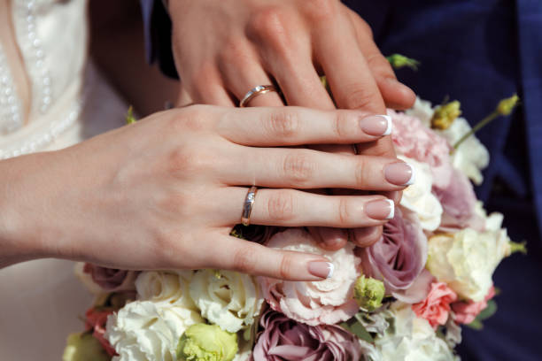 istock husband and wife holding hands 1321934780