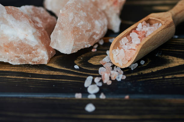 istock Himalayan salt on wooden background 1321935346