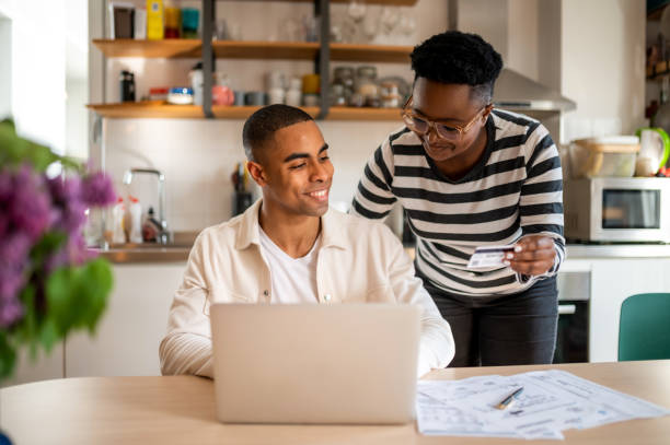 istock Young couple shops online 1321936654