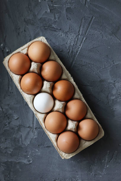 istock Collection of white and brown eggs isolated on white background 1321939900