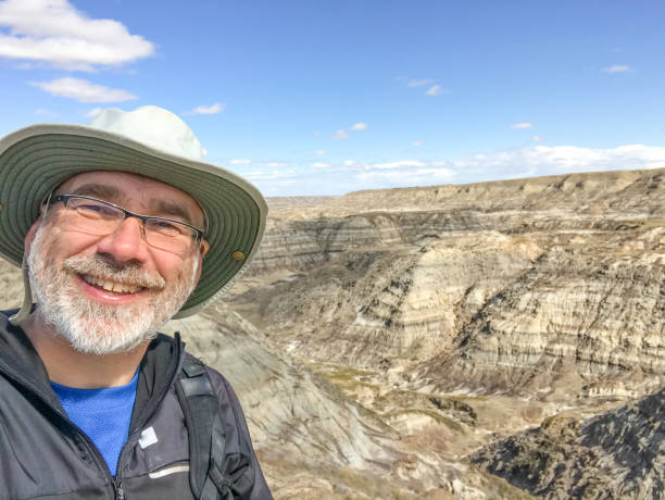 Selfie of man with Badlands in background