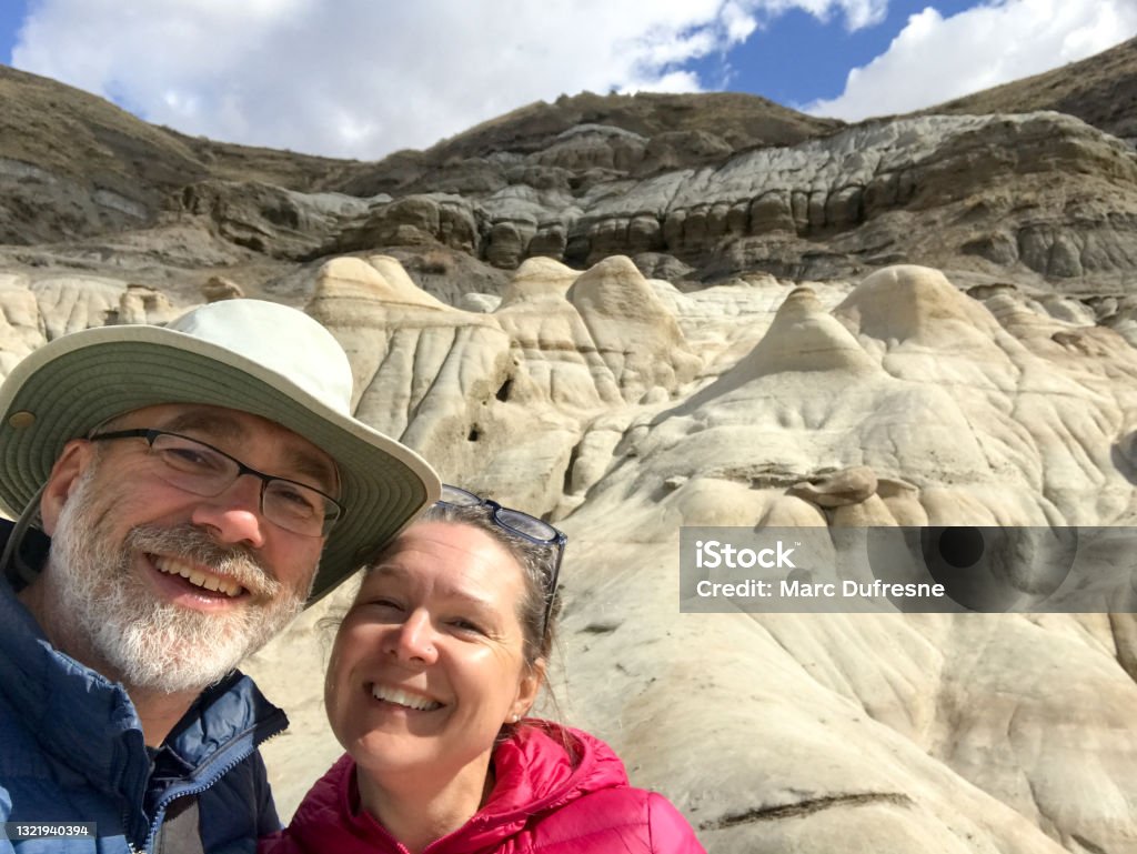 Selfie of couple with Badlands in background Selfie of woman and man with Badlands  in background during springtime

NOTE: Photo taken with mobile phone Selfie Stock Photo
