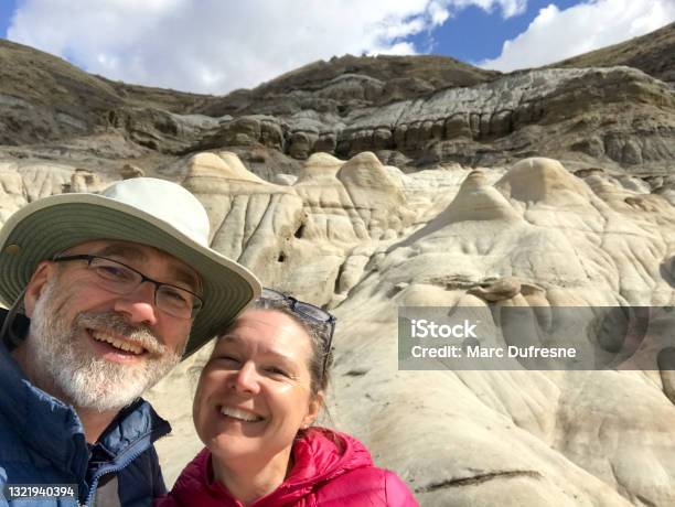 Selfie Of Couple With Badlands In Background Stock Photo - Download Image Now - Selfie, Springtime, Alberta