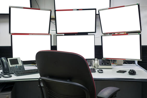 istock group of blank monitors and screen on security desk or control room for monitor process or stock data trading. 1321940805