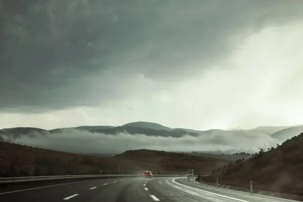 Photo of Highway in stormy weather with dramatic sky