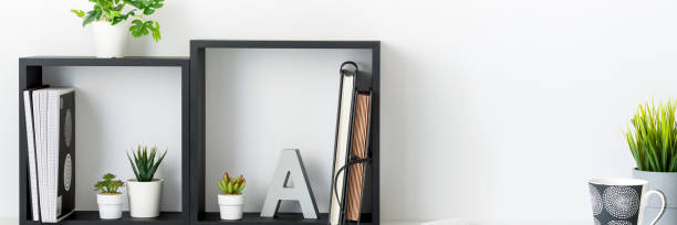 istock Home office. A desk against a white wall. Copy space. An open book. 1321941924