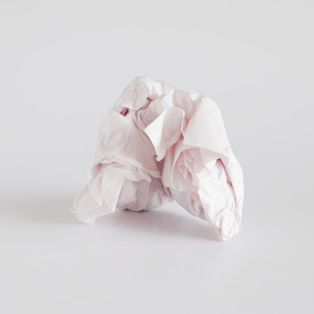 istock Crumpled paper ball isolated on background. 1321950888