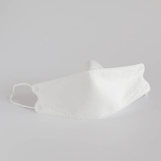 istock Medical mask or surgical earloop mask isolated on white background. 1321950892