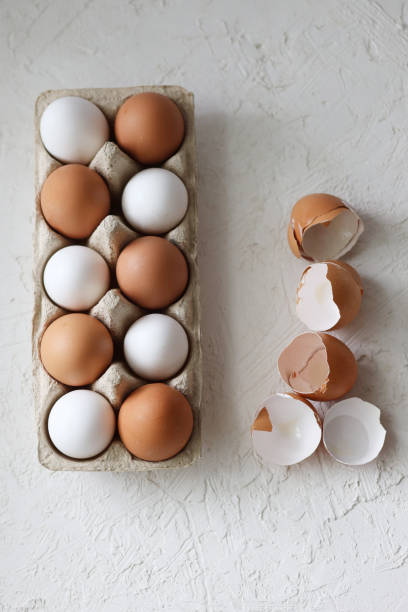 istock Collection of white and brown eggs isolated on white background 1321951162