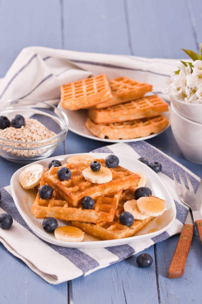istock Waffles with blueberries, bananas and honey. 1321954993