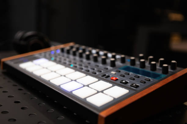 istock Synthesizer board with push pad buttons and volume regulators. Professional audio equipment for electronic music production 1321955299