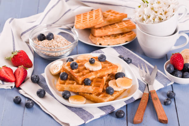 istock Waffles with blueberries, bananas and honey. 1321956496