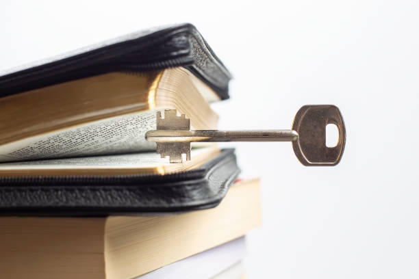 istock key and open book bible. metaphor key to cognition wisdom and knowledge 1321957595