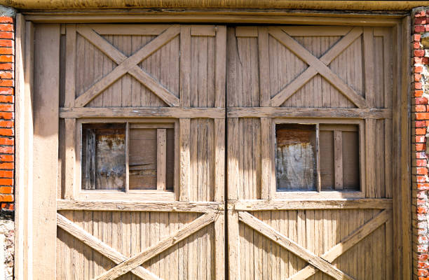 istock retro vintage ranch stables farm barn doors with weathered aged facade in bright sunlight with shadows 1321959556