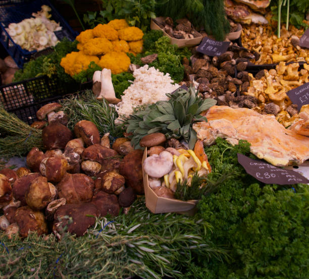 istock Selection of assorted mushroom types displayed for sale 1321960611