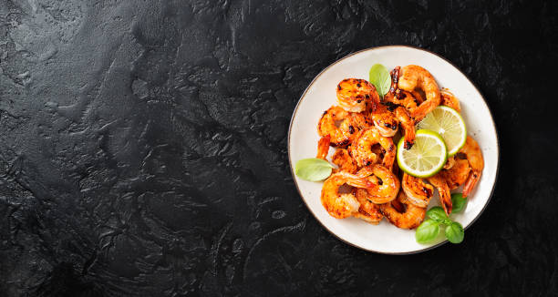 istock Grilled tiger shrimps with spice and lime 1321965080