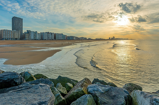 Oostende (Ostend) city beach at sunset by the North Sea, Flanders, Belgium.