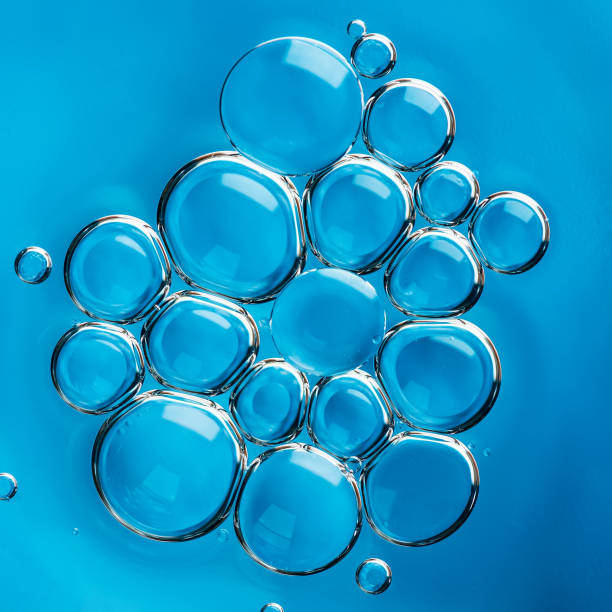 istock Beautiful abstract turquoise blue background with oil and water drops. 1321971630