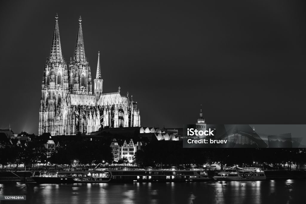 Cologne, Germany. View Of Cologne Cathedral. Catholic Gothic Cathedral In Night. UNESCO World Heritage Site. Black And White Colors Cologne, Germany. Night View Of Cologne Cathedral. Catholic Gothic Cathedral In Night. UNESCO World Heritage Site. Black And White Colors. Black And White Stock Photo