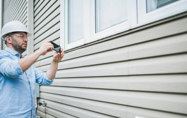 istock Building inspector using his phone to take photos. 1321985134