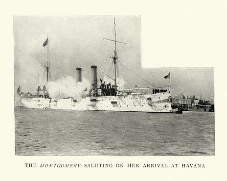 Vintage photograph of USS Montgomery (C-9), United States Navy Warship, unprotected cruiser, 1890s.  Firing a salute on her arrival at Havana, Cuba