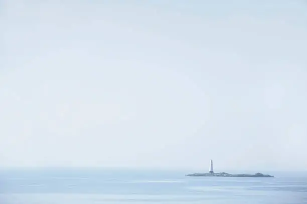 Photo of single lighthouse mindfulness empty background with ocean and blank sky