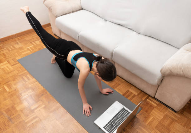 istock Young woman doing Yoga at home 1321996550