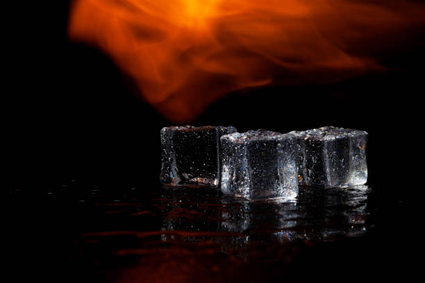 istock three ice cubes and flames on a black background, place under the text 1321997129