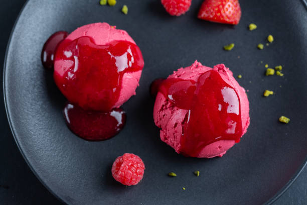 istock Fruity strawberry Ice cream scoops with strawberry sauce served on plate 1322007182