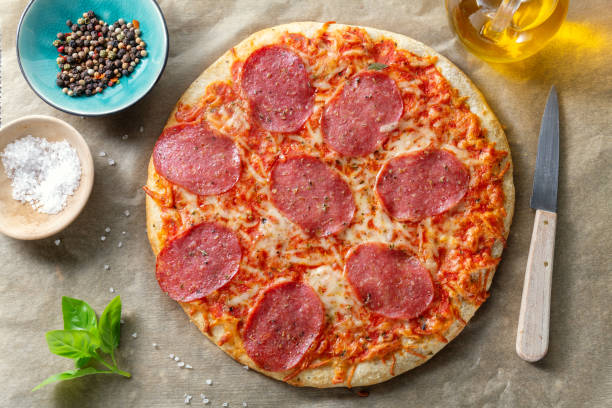 istock Salami pizza with cheese macro 1322007255