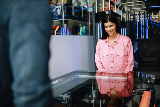 istock young couple in the video game arcade against each other 1322010809