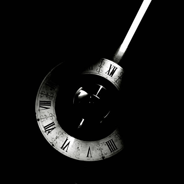 istock A vintage clock with a bright ray of light in black and white 1322027065