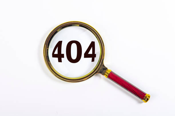 istock 404 error inscription. Magnifier on white background 1322027180