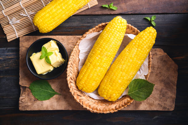 istock Sweetcorn and butter on wooden background 1322032286