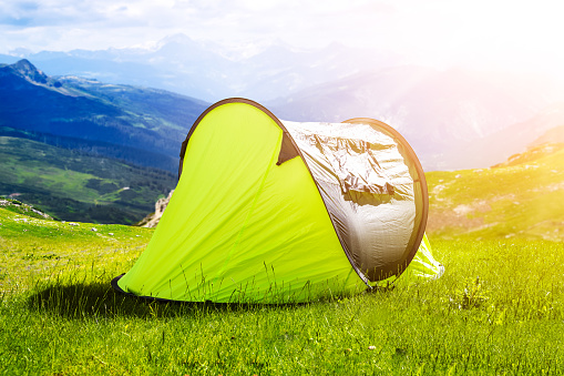 Adventure Hiking Trip In Mountains. Tourist Travel Tent