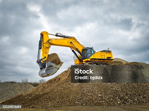istock Excavator blue sky heavy machine construction site 1322051683